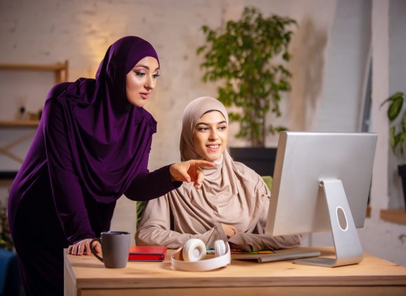 Happy muslim woman at home during online lesson. technologies, remote education, ethnicity concept
