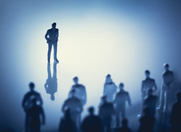 single-man-standing-front-group-people