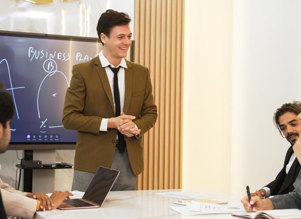 Presentation in ornamented meeting room with business professionals