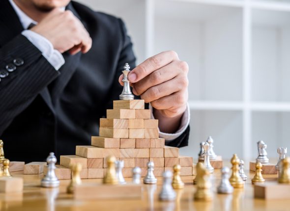 businessman-playing-chess-game-development-analysis-new-strategy-plan